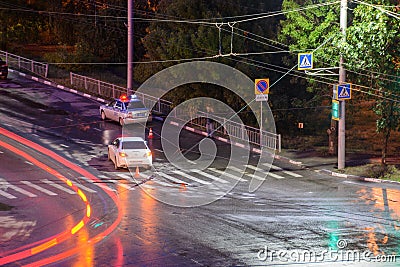 Ulyanovsk, Russia - April 10, 2020. At the crossroads at night, the driver violated and knock down a pedestrian. The police draw Editorial Stock Photo