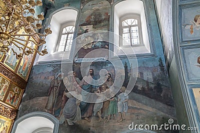 Old frescoes - ancient paintings of jesus christ on the inner walls of a temple or church after restoration. Frescoes of the Editorial Stock Photo