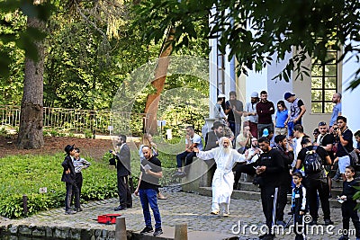 Uman Ukraine. Hasidic Jews dance, sing and pray during the Jewish New Year in the park Editorial Stock Photo