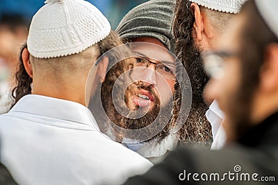 Rosh Hashanah, Jewish New Year 5777. Pilgrims of Hasidim in traditional festive attire celebrate mass in sity the Uman. Editorial Stock Photo