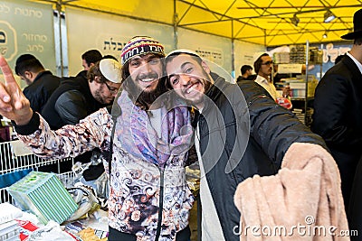 Uman,Ukraine, 13.09.2015: Two smiling Jewish guys are posing on camera Editorial Stock Photo