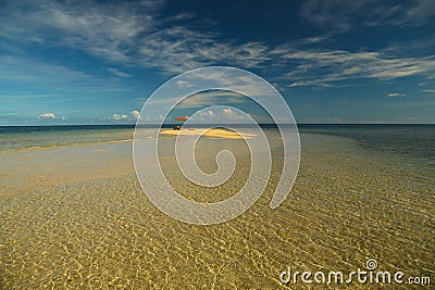 Umbrella on Deserted Island Stock Photo