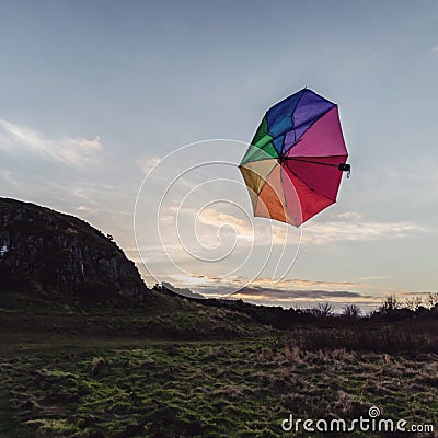 Umbrella flying away on blackford hill Stock Photo