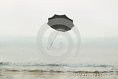 Umbrella flying in the sky, concept of solitude and freedom Stock Photo