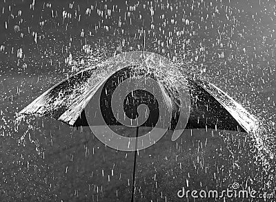 Umbrella in heavy rain Stock Photo