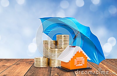 Umbrella protection coins savings Stock Photo