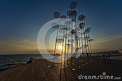 Umbrella sculpture on the promenade of Thessaloniki in the sunset Editorial Stock Photo