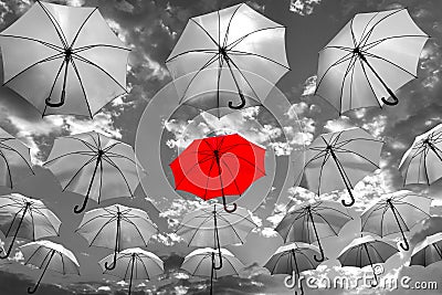 Umbrella standing out from the crowd unique Stock Photo