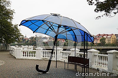 An umbrella for tourists, under which there is a USB charger for the phone and other mobile devices Editorial Stock Photo