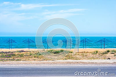 Umbrellas on the abandoned beach Stock Photo