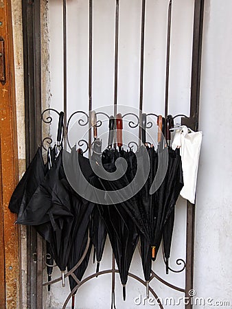 Umbrellas at the door of a yeshiva Stock Photo