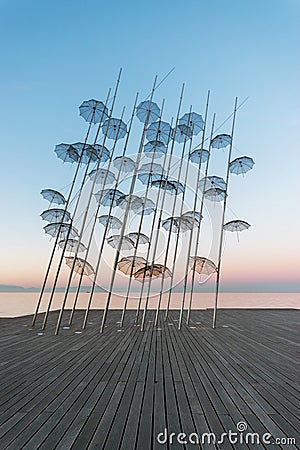 The `Umbrellas` installation at the New Waterfront of Thessaloniki during sunrise in Greece Editorial Stock Photo