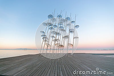 The `Umbrellas` installation at the New Waterfront of Thessaloniki during sunrise in Greece Editorial Stock Photo