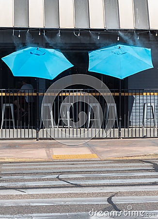 Umbrellas at the sidewalk saloon Stock Photo