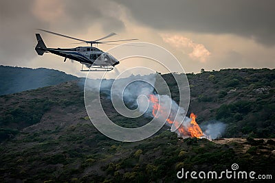 UN helicopter battles forest fire on Lebanons border Stock Photo