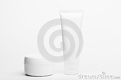Unbranded plastic tube and jar. Flacon for cream, body lotion, toiletry. Container for professional cosmetics product. Skincare Stock Photo