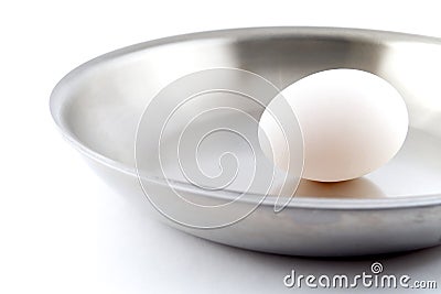 Unbroken Egg on a Pan Stock Photo