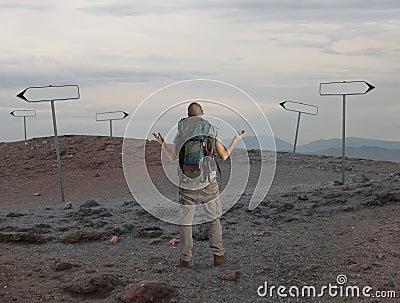 Uncertain explorer is lost in a desert Stock Photo