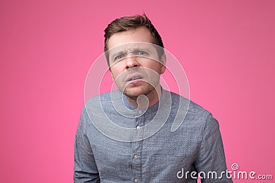 Uncertain upset pensive male hesitates what to choose. Facial expressions concept. Stock Photo