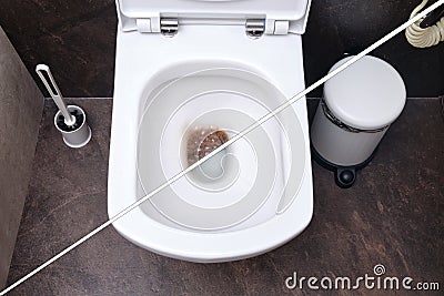 Unclogging toilet dirt. Before and after fixing the blockage problem Stock Photo