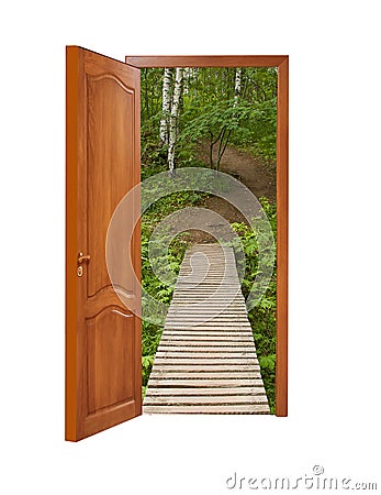 unclosed wooden door with a kind on a wooden path in a birchwood Stock Photo