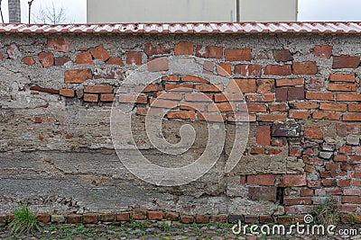 Unconventional masonry with different bricks Stock Photo