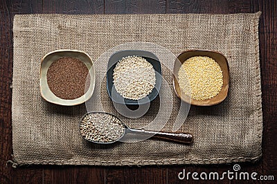 Uncooked ancient grains of teff, sorghum, millet and buckwheat in seed form. Stock Photo