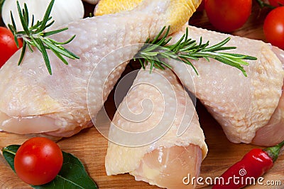 Uncooked chicken thigh -raw - chicken with vegetables Stock Photo