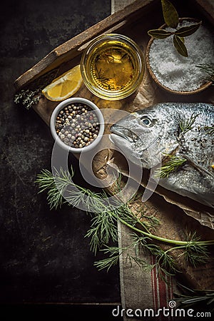 Uncooked fresh fish with herbs and spices Stock Photo