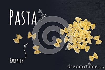 Uncooked Italian pasta Farfalle on black slate stone background Stock Photo