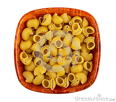 Uncooked pasta lumache in bowl isolated on white. Top view Stock Photo