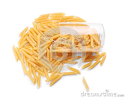 Uncooked Penne pasta in an inverted glass. Fresh macarons near a glass, isolated on a white background. Raw pasta. Dry macaroni. Stock Photo