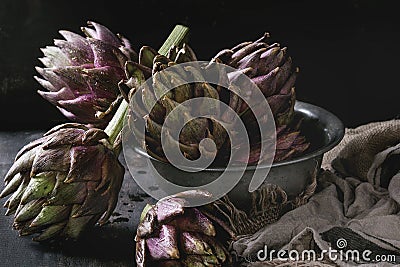 Uncooked purple artichokes Stock Photo