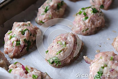 Uncooked raw healthy meat balls ready to be cooked on the oven Stock Photo