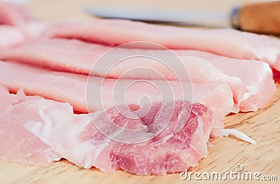 Uncooked slices of fresh pock meat Stock Photo