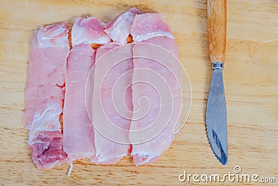Uncooked slices of fresh pock meat Stock Photo