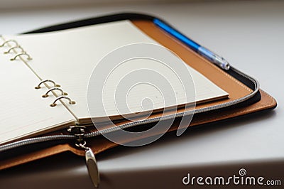 Undated diary on rings with blue pen Stock Photo