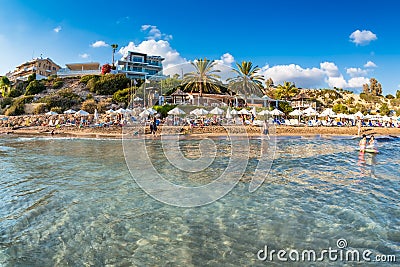 Undefinable people relaxing on Coral Bay Beach, one of the most famous beach Editorial Stock Photo