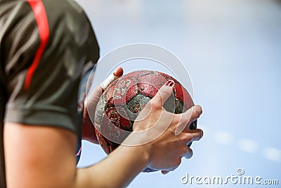 Undefined hands holding a ball prior to the Greek Women Cup Final handball game Arta vs Nea Ionia Editorial Stock Photo