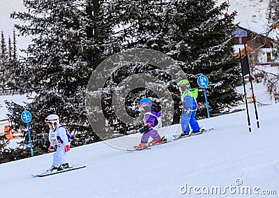 An undefined small skiers on the track of the competitionin Editorial Stock Photo