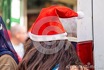 Undefined young woman wear santa hat Stock Photo