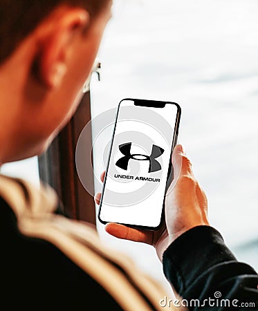 Under armour on iphone in hand realistic texture Editorial Stock Photo