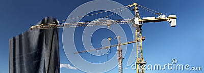 Under construction site building with crane and glass skyscraper Stock Photo