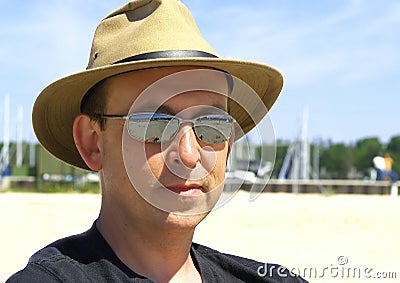 Under a Hat on the Beach Stock Photo