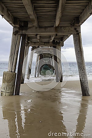 Under neith Port Noarlunga Jetty. Beams and Structures. Stock Photo