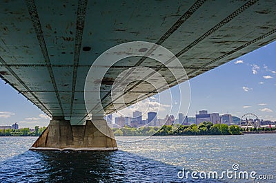 Under steel bridge across river leading to downtown Montreal, Quebec, Canada Editorial Stock Photo