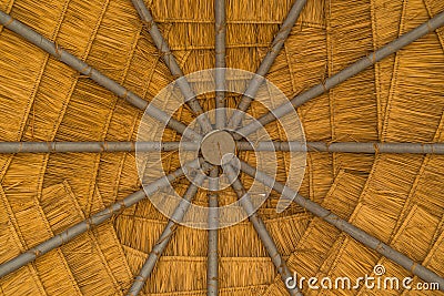 Under thatched roof natural Stock Photo