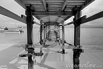 Under wooden jetty structure at Mantanani Island Stock Photo