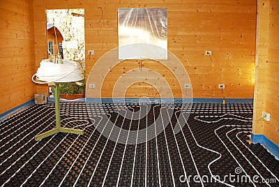 Underfloor Heating System in Wooden House Stock Photo
