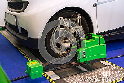 Undergoing auto wheel alignment on technical service Stock Photo